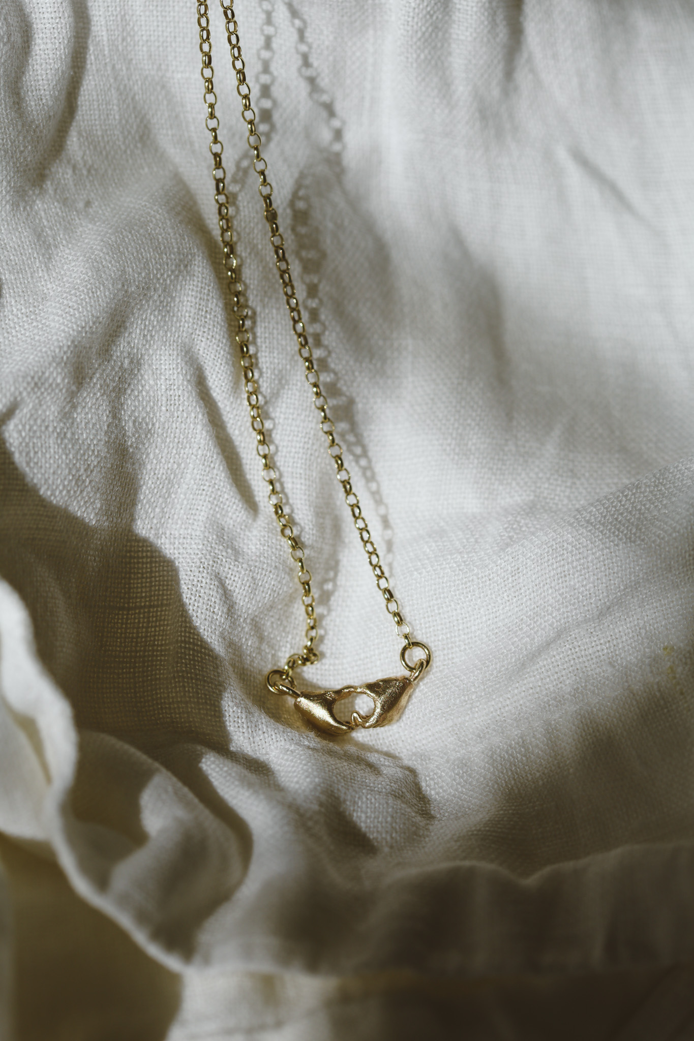 A Quiet Bond | Hand Heart Gold Necklace