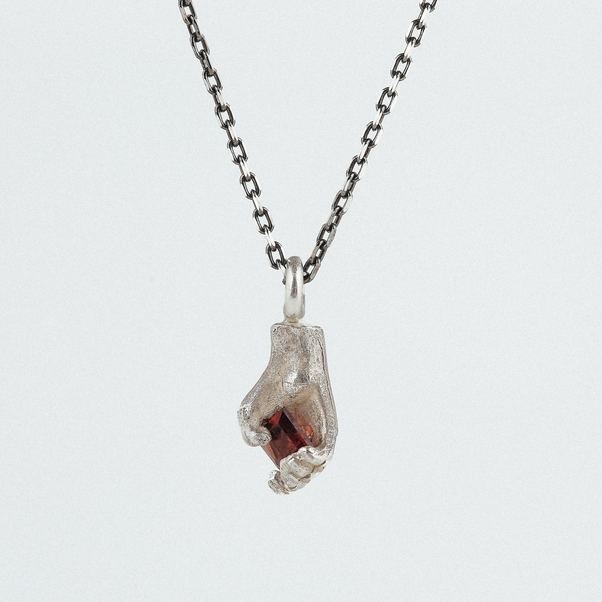 Square Heart | Silver Hand Pendant with Garnet ‣ Dovile Bertulyte